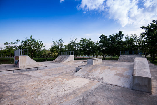 Empty skate park in the morning grind rails. Concrete cement.