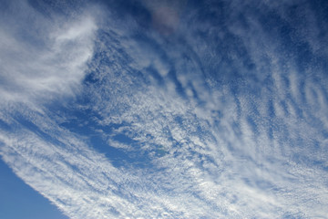 Naklejka na ściany i meble White cloud on blue sky backdrop