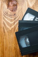 VHS cassettes on a wooden table