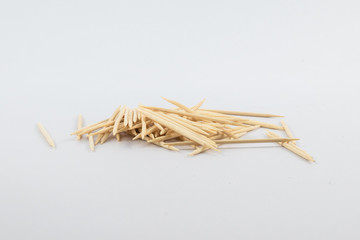 Pile of wooden toothpicks isolated on white. Bunch of toothpicks