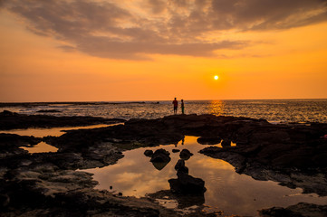 Two people at sunset in Twostep, Hawaii, USA