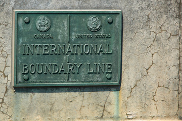International Boundary Line Canada USA. Plaque indicating the international boundary line between the United States and Canada. Between New York state and the province of Ontario.