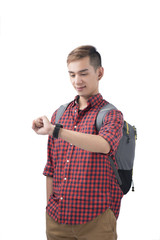 Portrait of a smiling student looking on wrist watch over white