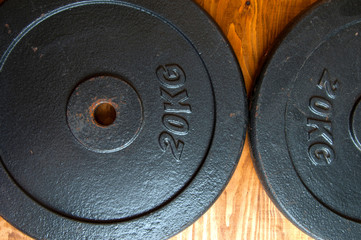 20 kg. Weight on a wooden backgound.