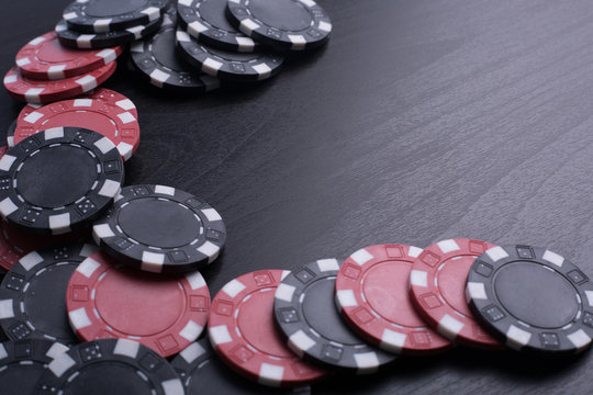 Casino poker chips and playing card with black background