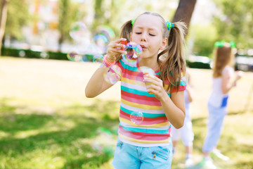 Girl with soap bubbles