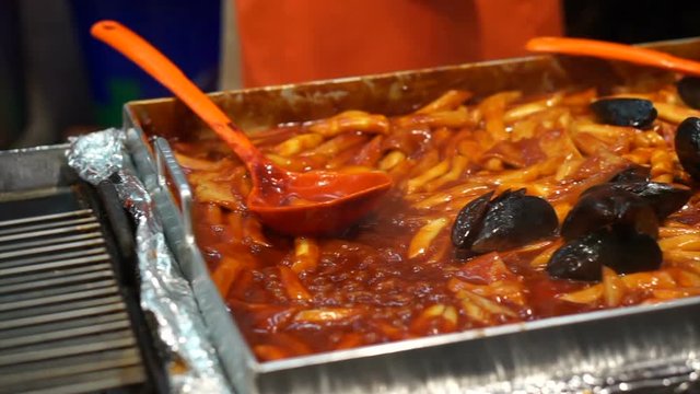 Red spicy rice cake, korean food. White korean pasta with chilli sauce Tteokbokki