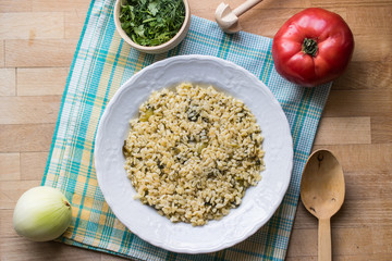 Bulgur rice served with wooden spoon