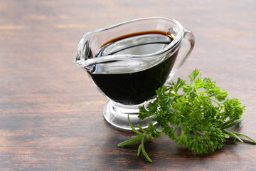 balsamic vinegar in a glass gravy boat