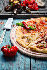 Pizza and baked vegetables