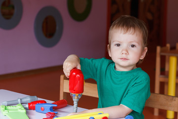 kid child boy playing with toys