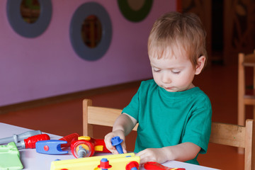 kid child boy playing with toys