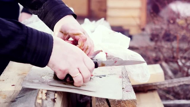 Cooks hands cleaning the fish an outdoor on the sun background. 3840x2160
