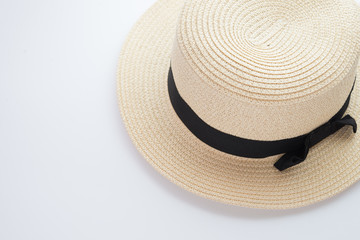 Fototapeta na wymiar Round straw hat on a white background