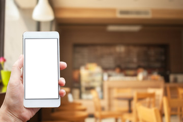 Business conceptual- Focused on left hand holding mobile on cafe blurred background