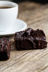 Tasty vegetarian brownie slice on wooden table for celebration.