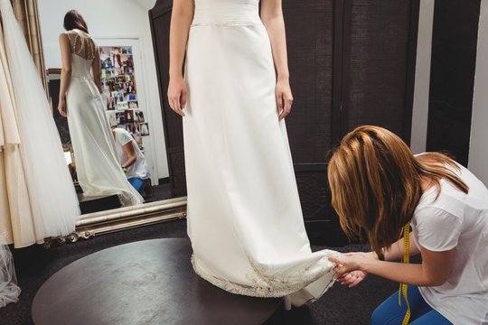 Woman trying on wedding dress