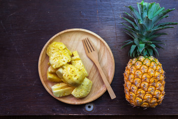 Pineapple and fork - Summer time vacation holiday healthy concept .