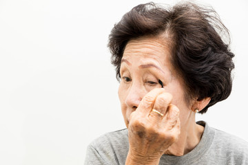 old woman applying make up,asian people, asian women