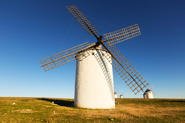 Fototapeta na wymiar Group of windmills in sunny day time