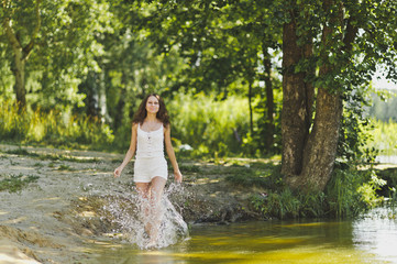 Portrait of a girl walking on the water of the lake 6335.