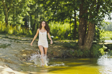 Portrait of a girl walking on the water of the lake 6337.