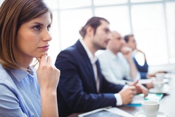 Businesswoman with colleagues during meeting 