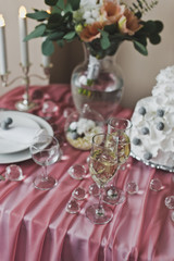 The champagne glasses are on a pink, decorated the table 6446.