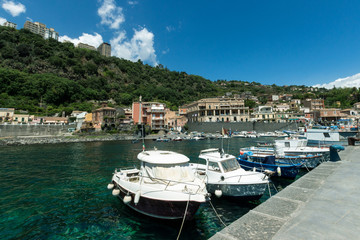 Fototapeta na wymiar Sea port, boats and houses in Sicily.