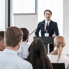 Speaker at presentation to audience