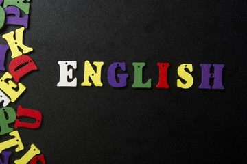 Word english made with colorful letters at abstact blue grunge background
