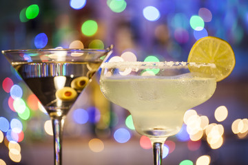 Glasses of margarita and martini cocktails