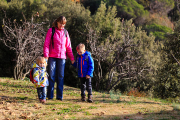 mother with two kids travel in mountains