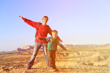 father and son travel in scenic mountains