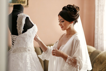 The bride looking at wedding dress