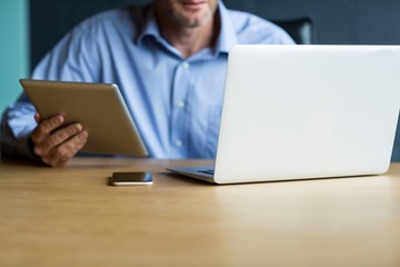 Man using laptop in creative office