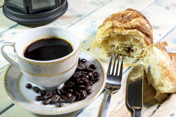 Black coffee with Beans and Croissant