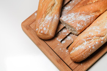 Baguettes on a brown background. Isolation