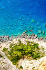 Rocky beach with clear blue waters on the island Zakynthos, Gree