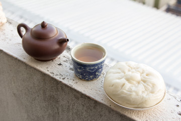 Chinese teapot and Chinese tea and dumplings streamed.