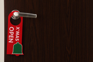 open on christmas door sign