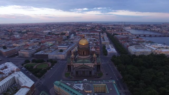 Aerial top view of first light over St.Petersburg Saint Isaac's Cathedral. Unique close approach. Movie style shot.