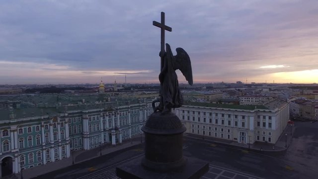Dramatic morning light Dvortsovaya square in St.Petersburg. Aerial flight around Angel and cross Alexander Column