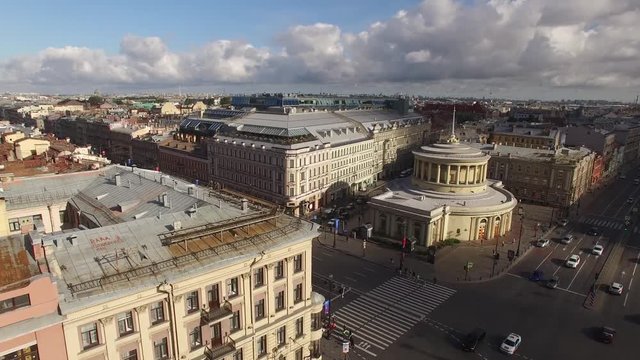 Beautiful aerial quadcopter view Vosstaniya Square in St.Petersburg Russia, Nevsky avenue with cars. Morning light. Old rooftops. Metro station.