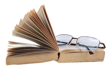 Open pocketbook and glasses isolated on white background