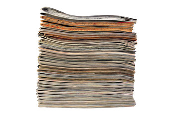 Stack of sewing magazines isolated on white background