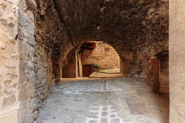 Narrow archway at the old street  in the village Coaraze, France