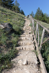 Fototapeta na wymiar old stone stairs on a hill