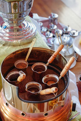 Making traditional greek / turkish black coffee on sand