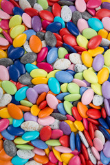 Fototapeta na wymiar Close-up background of multi colored chocolate candy
